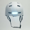Load and play video in Gallery viewer, White Bicycle Helmet with Built-In Rechargeable Front and Rear Lights, Designed for Enhanced Visibility and Safety for Both Men and Women
